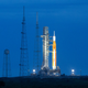 A photo of the NASA Artemis 1 rocket at night.